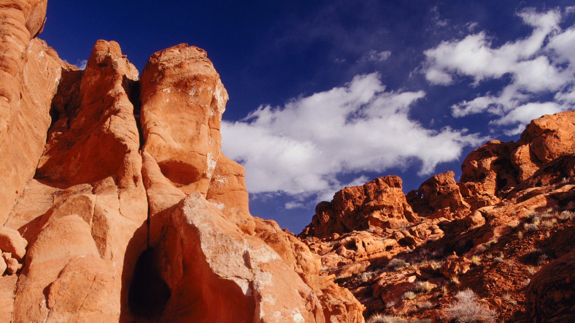 Red rock canyon walls under a deep blue sky